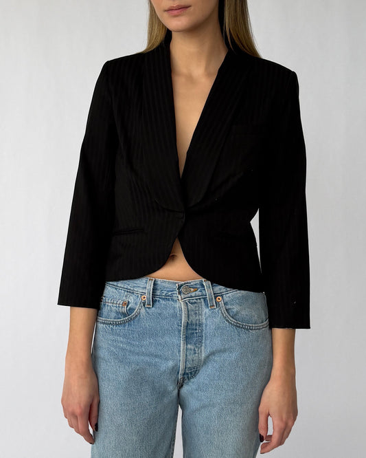 Close-up view of Alexander McQueen pinstripe blazer with three quarter sleeves