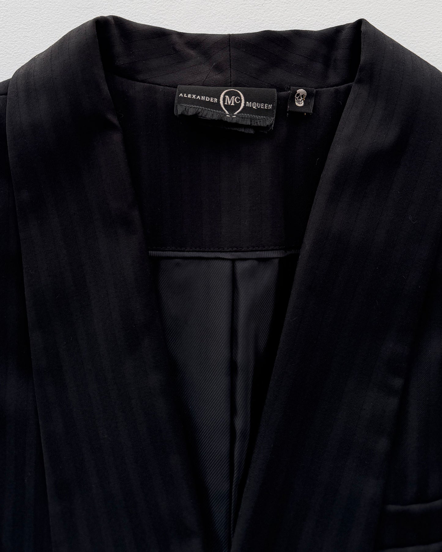 Alexander McQueen label on pinstripe blazer