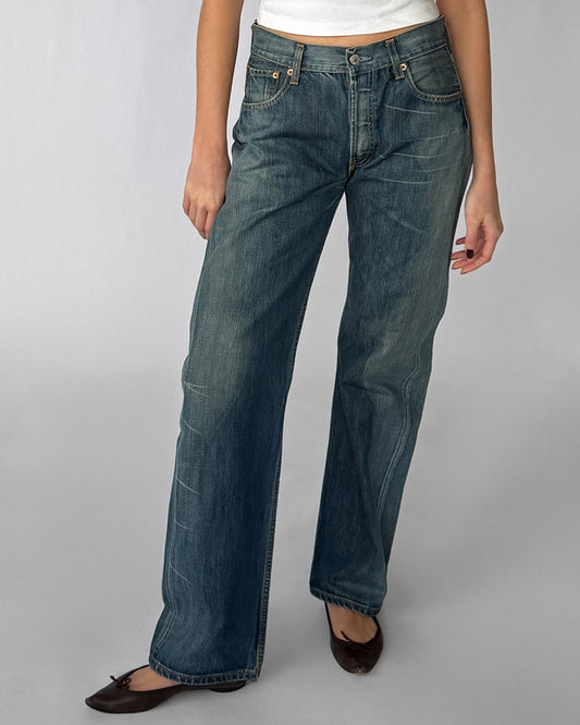 Close-up view of vintage 501 Levi's jeans with medium wash and straight leg