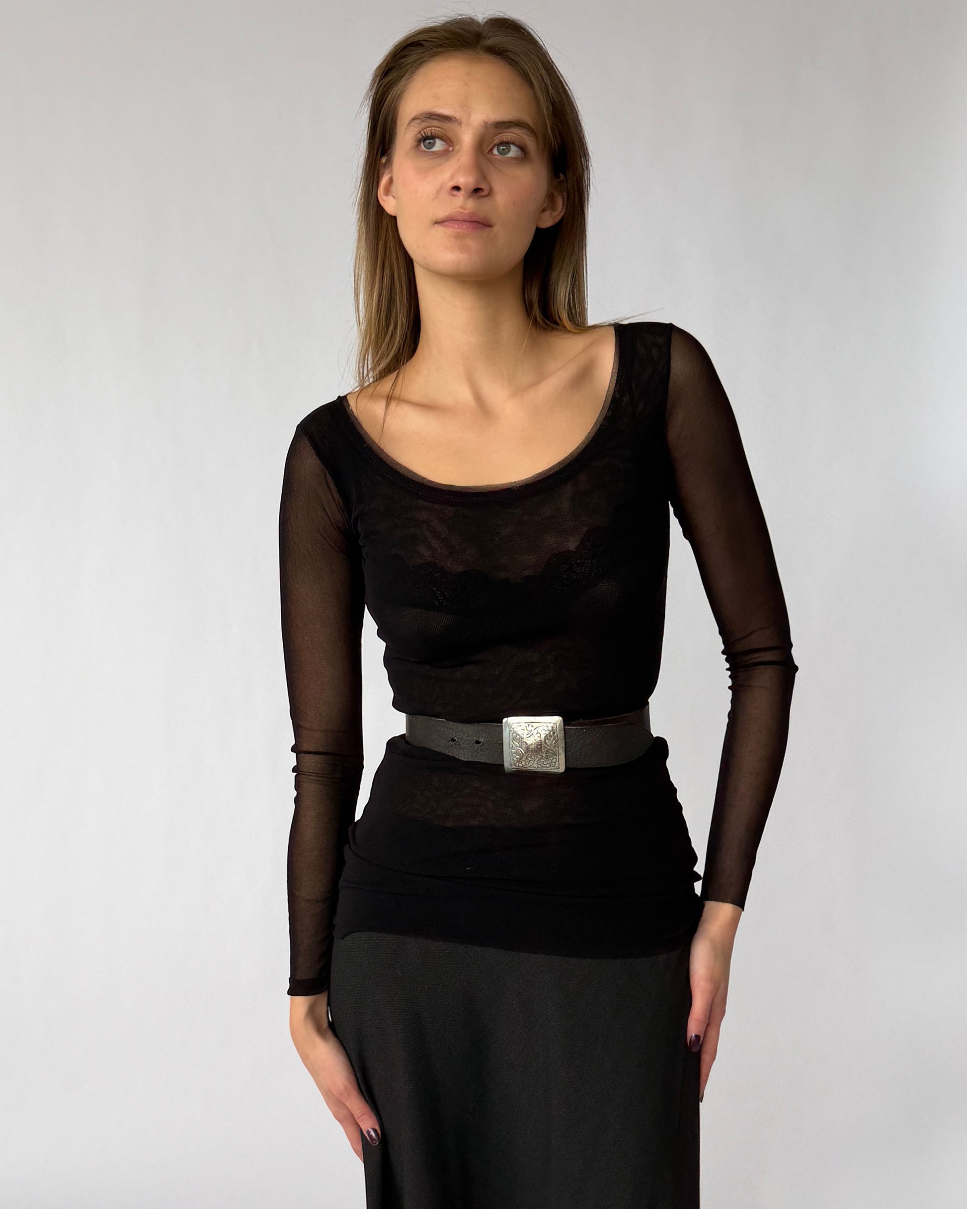 Vintage Agnès B. leather belt with engraved metal buckle worn by model