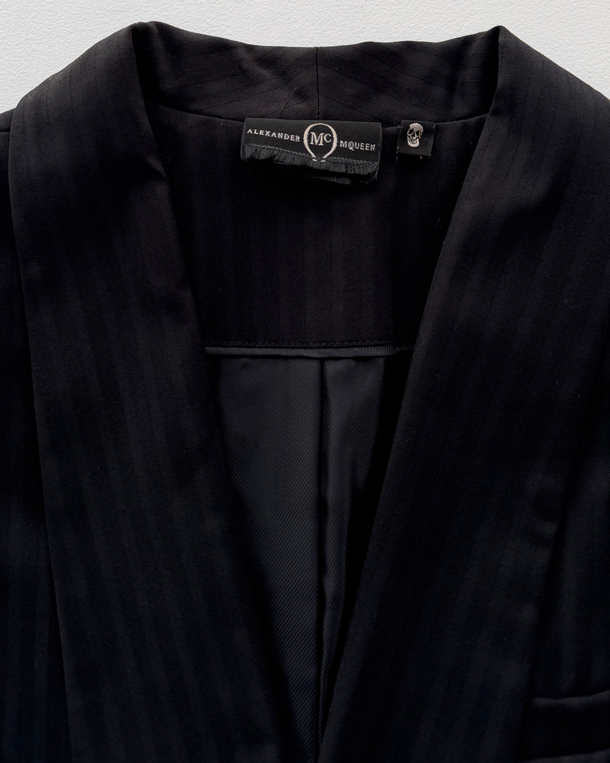 Alexander McQueen label on pinstripe blazer