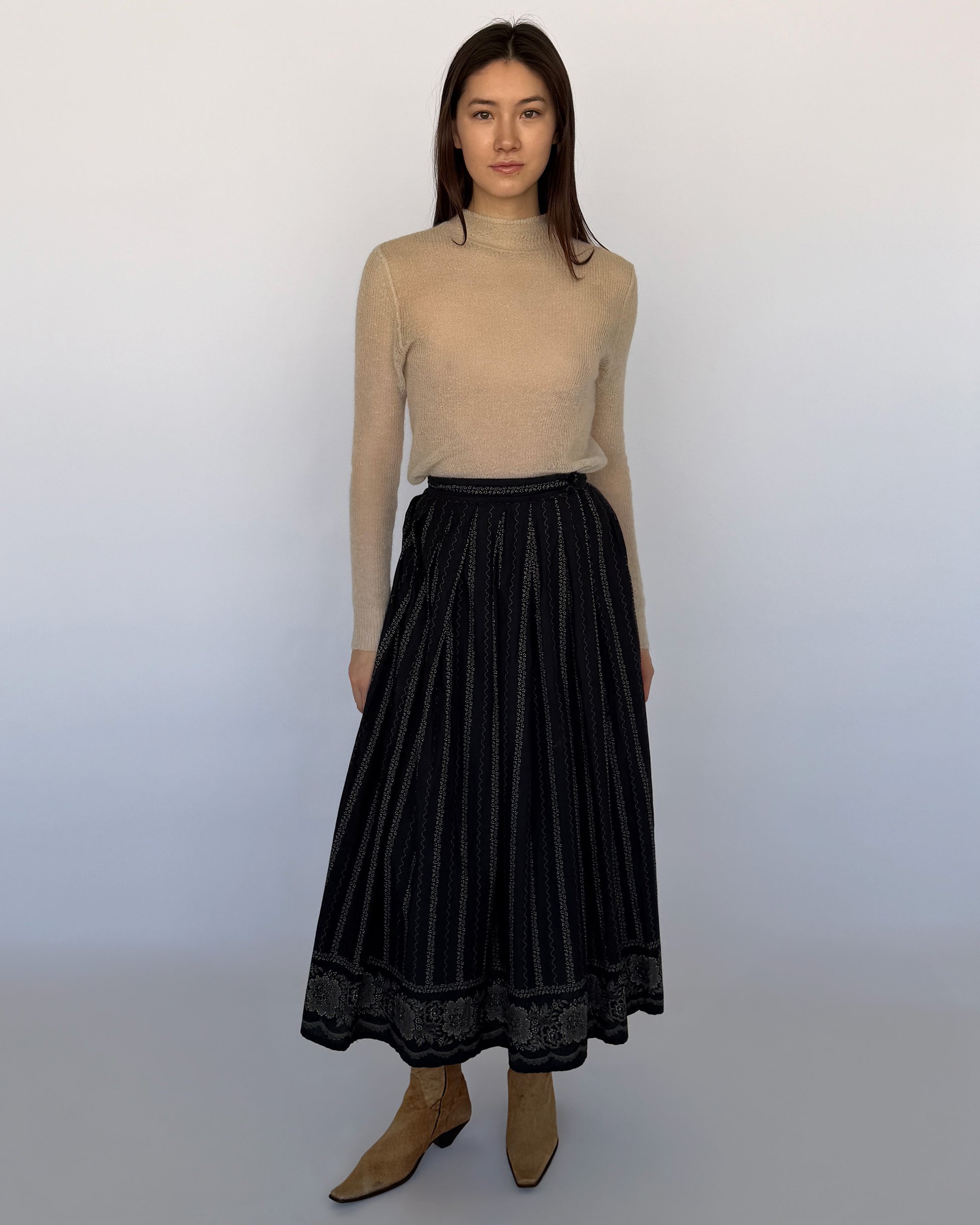 Agnès B. midi skirt with vertical stitched detailing and floral embroidered border hem