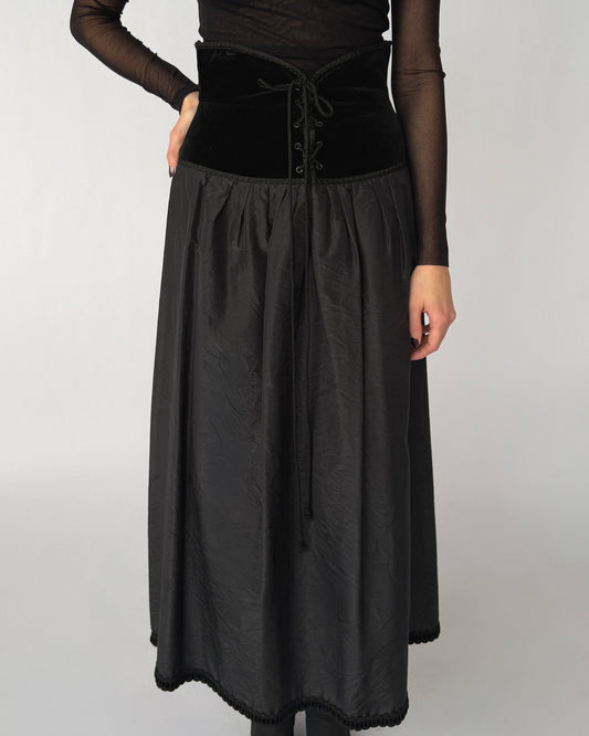 Close up view of vintage Blumarine silk and velvet skirt with lace-up waist detail