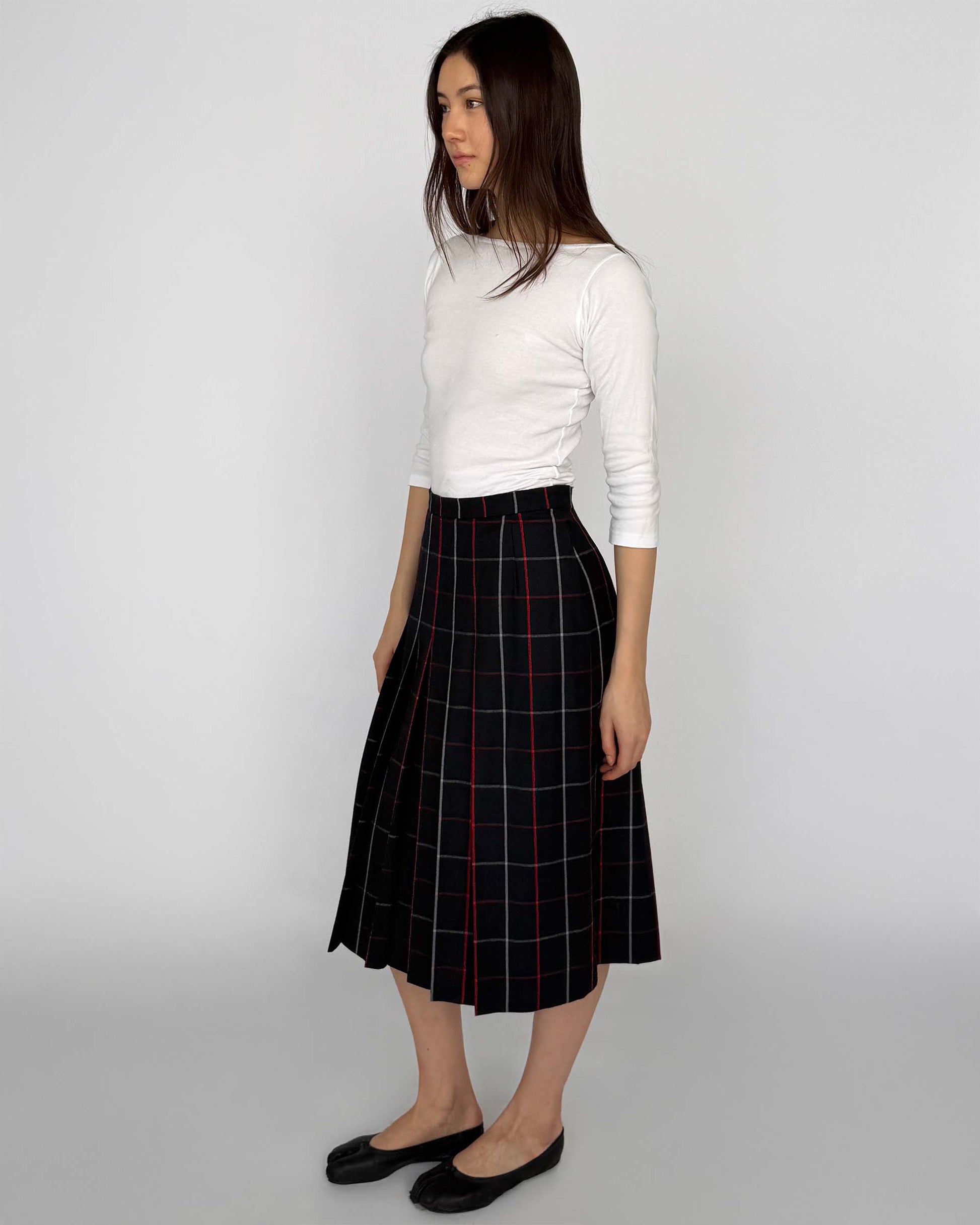 Side view of Burberry Long Plaid Pleated Wool Skirt