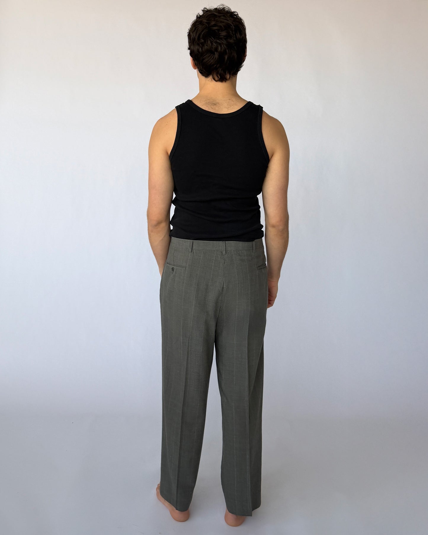 Back view of vintage Christian Dior Grey pinstripe pleated men's trousers