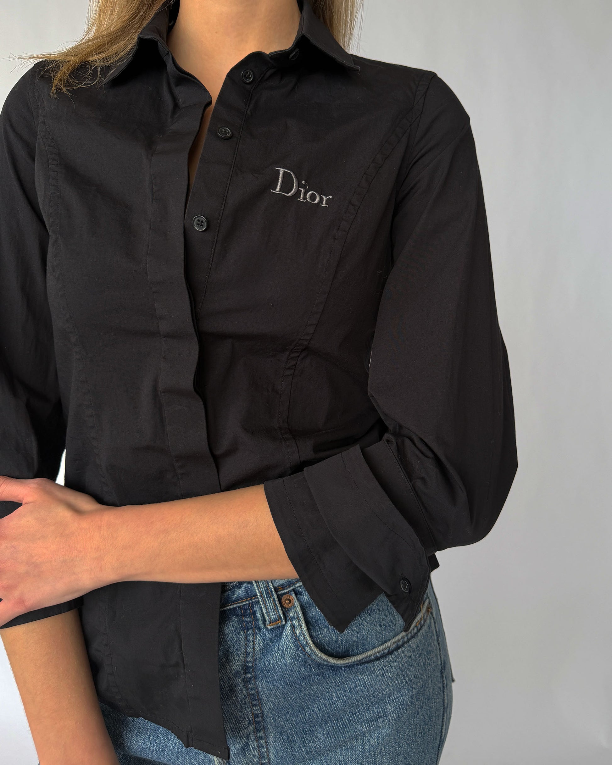 Detail view of Dior embroidered logo on vintage button up