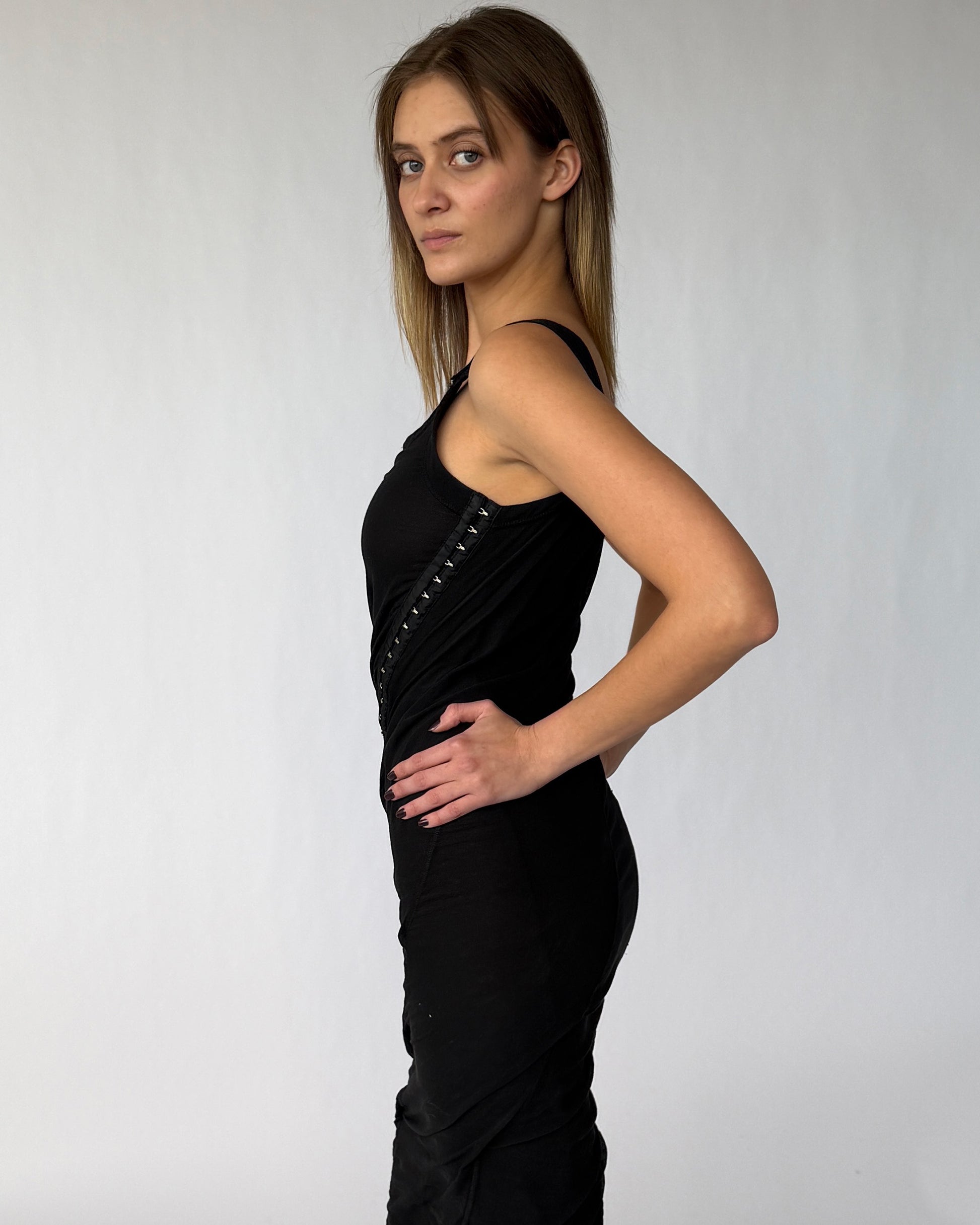 Side view of vintage Dolce & Gabbana black mesh dress with hook and eye detailing