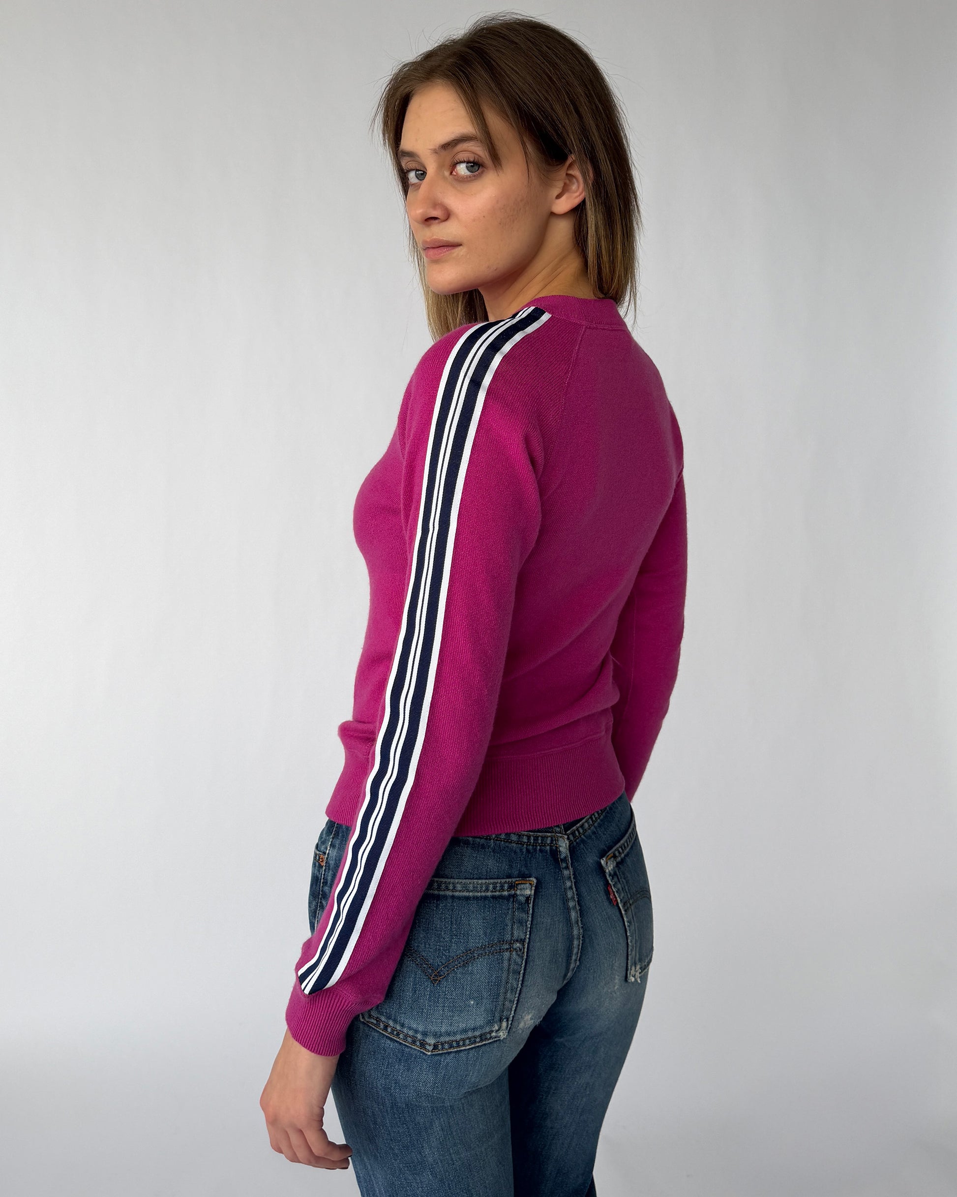 Side view of vintage Dolce & Gabbana pink cashmere sweater with striped sleeve detail