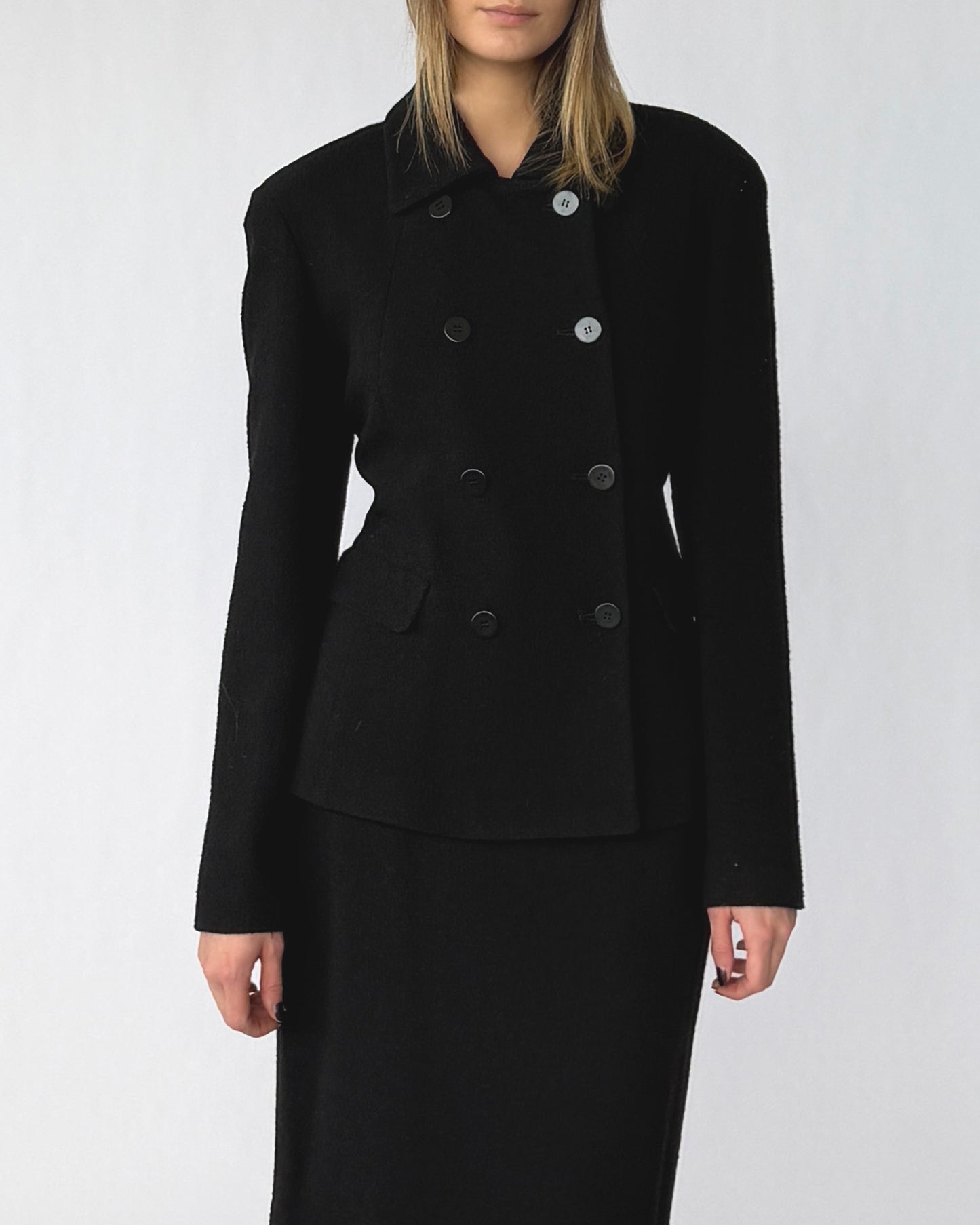 Close up view of vintage Donna Karan skirt and jacket suit set made from wool