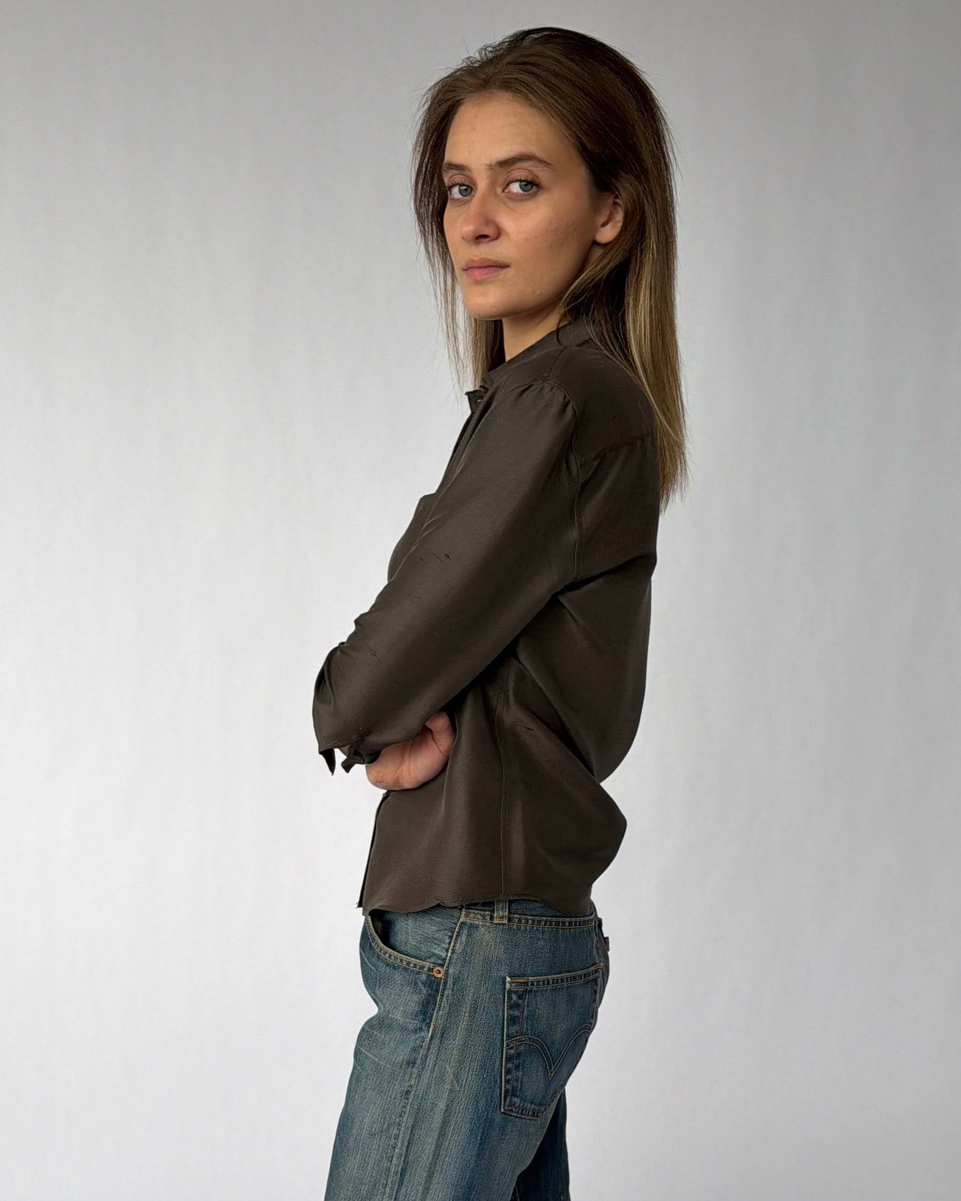 Side view of vintage Giorgio Armani silk button down top in brown