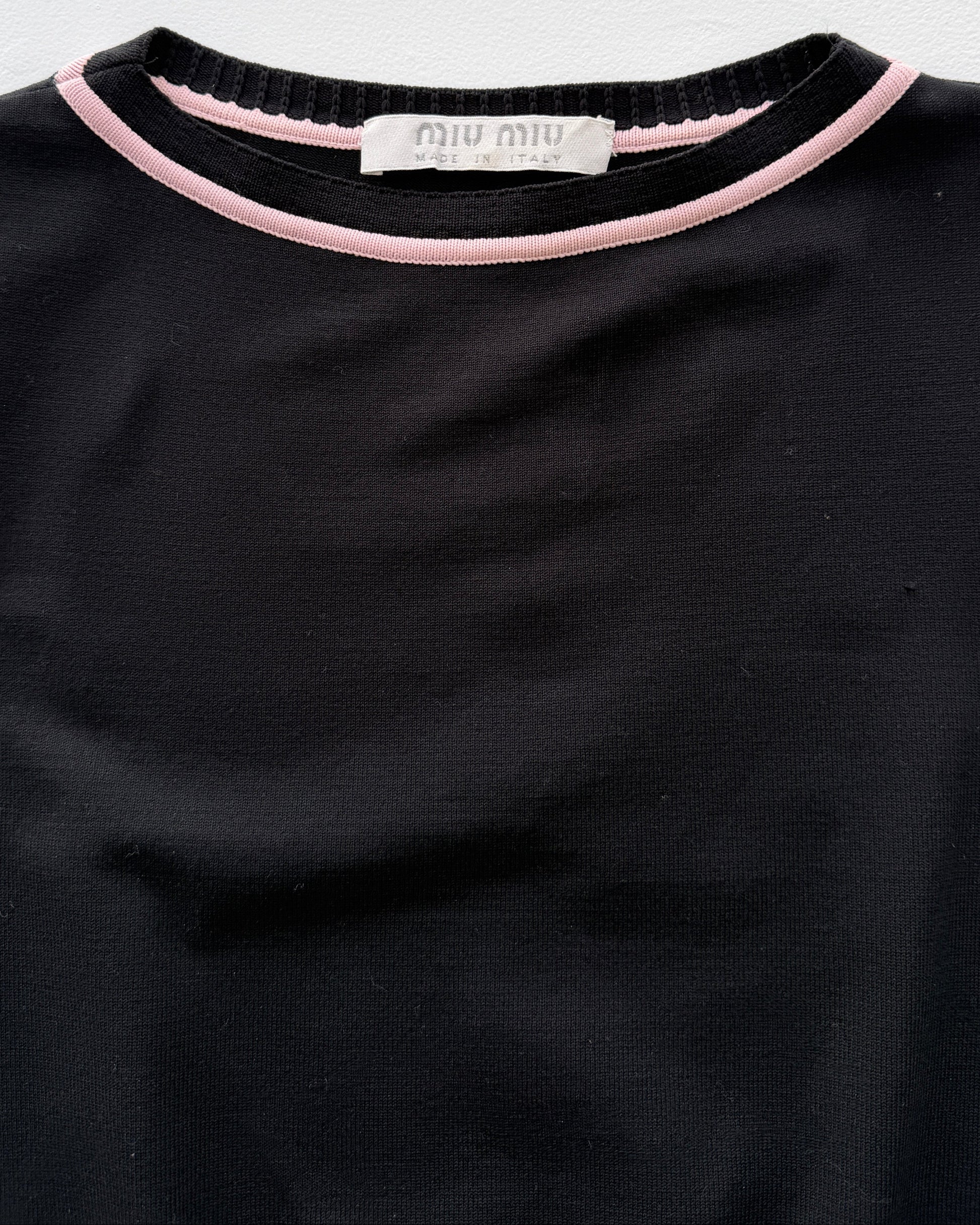 Label tag on vintage Miu Miu sleeveless peplum top