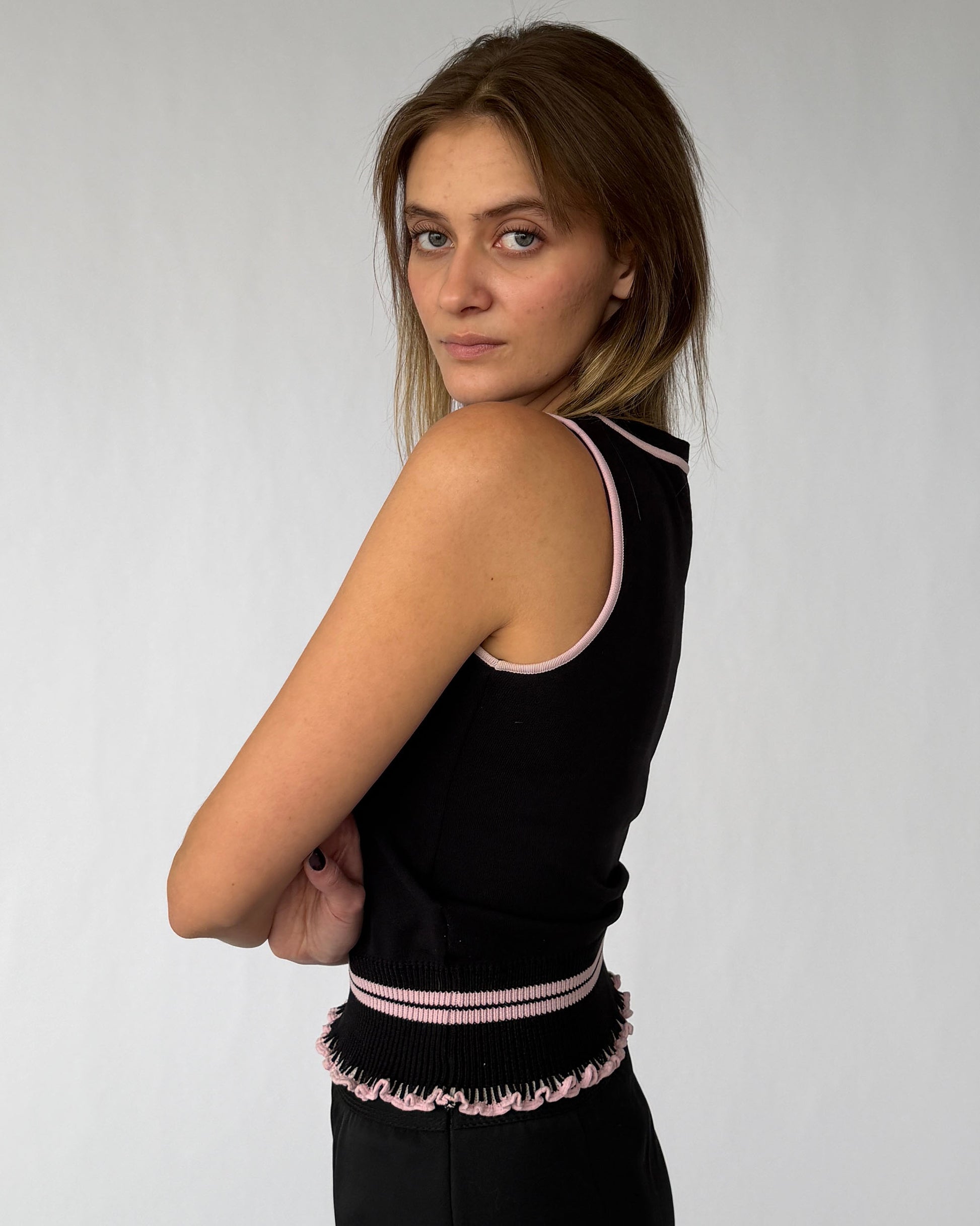 Side view of vintage Miu Miu sleeveless top with peplum