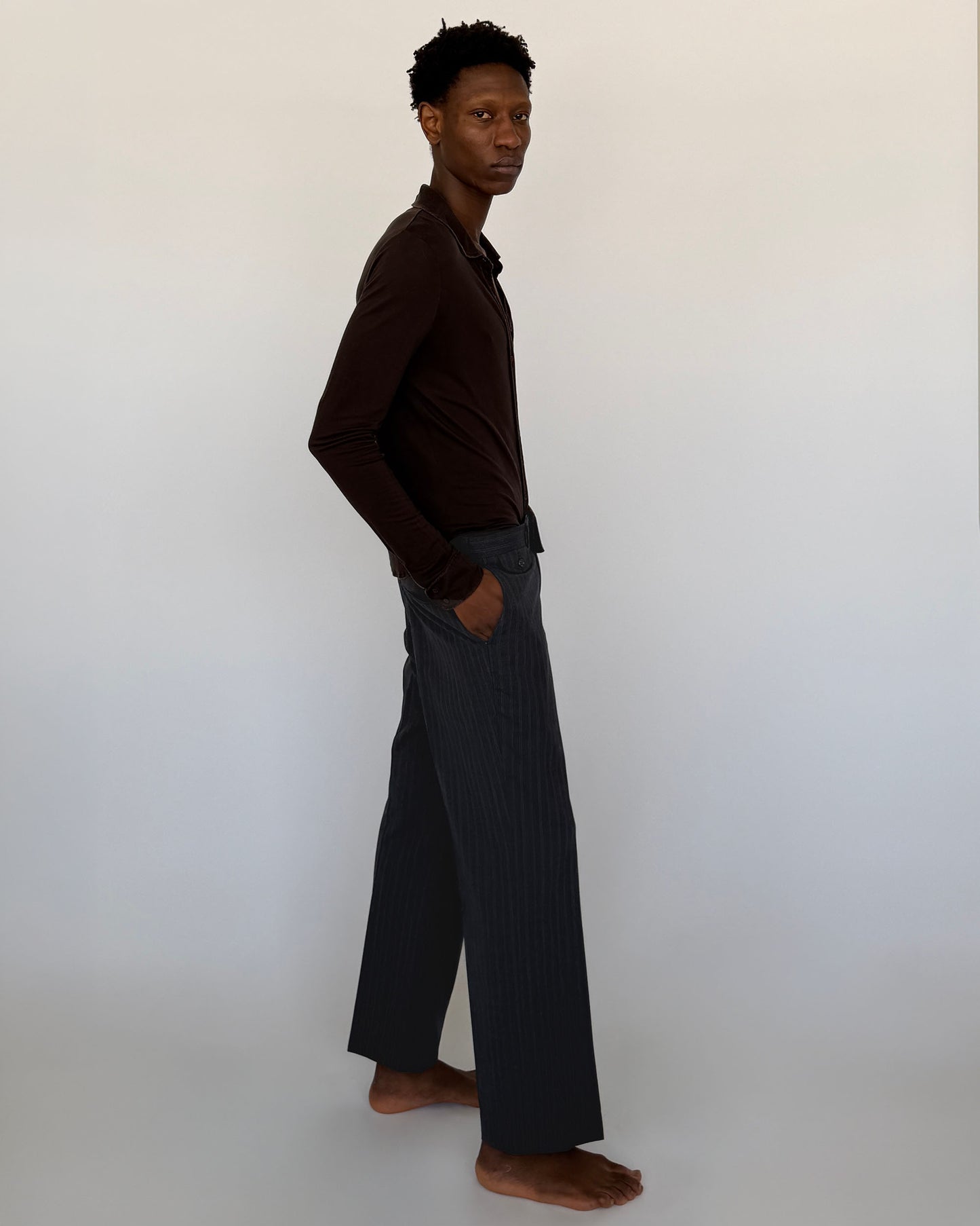 Side view ofVintage Navy Pinstripe Wool Trousers