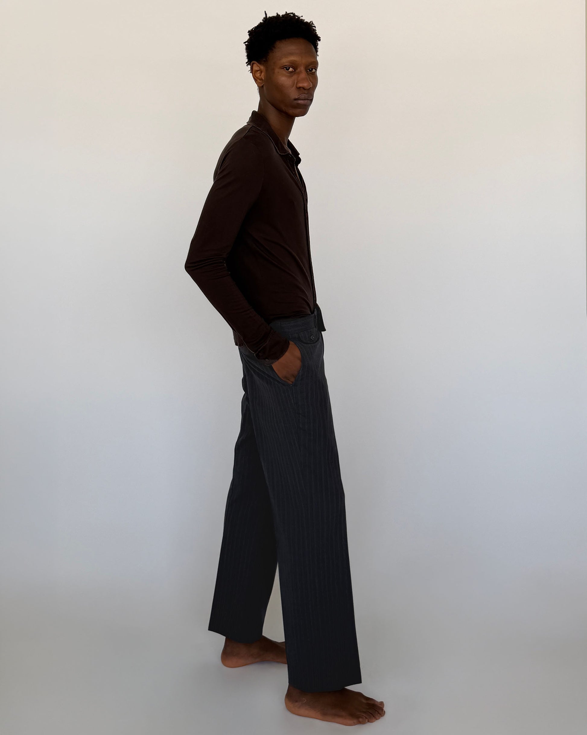 Side view ofVintage Navy Pinstripe Wool Trousers
