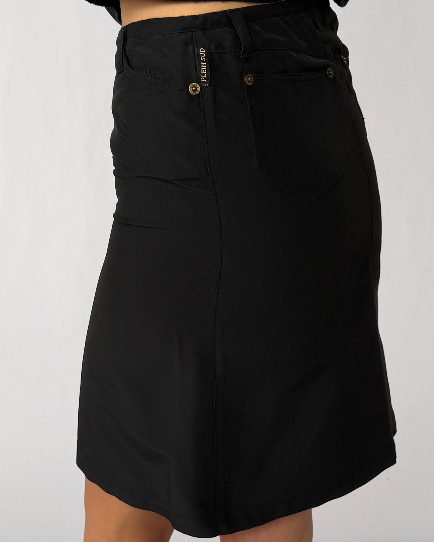 Label detail on vintage Plein Sud nylon skirt and jacket set