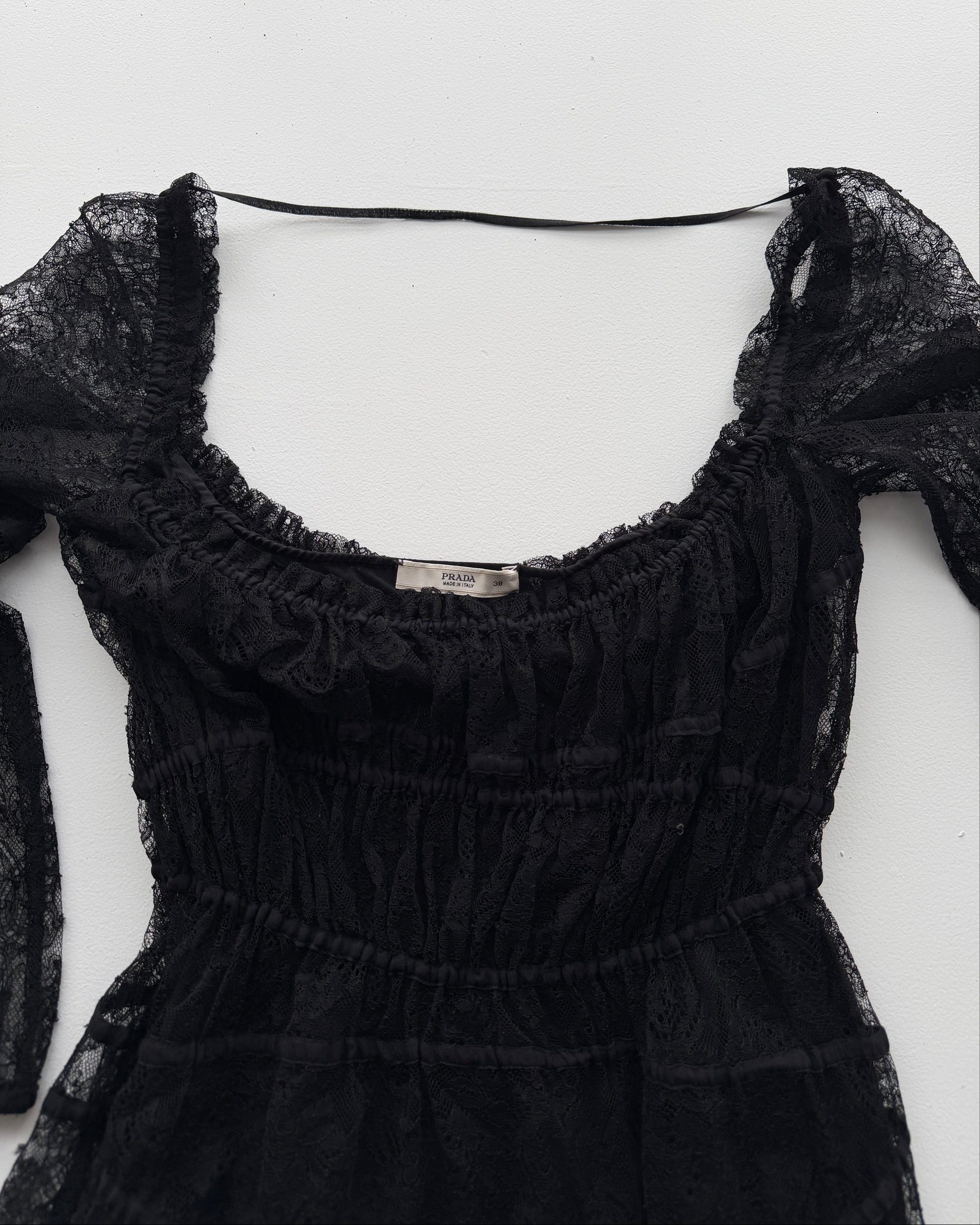 Label on Prada black lace midi dress from early 2000s
