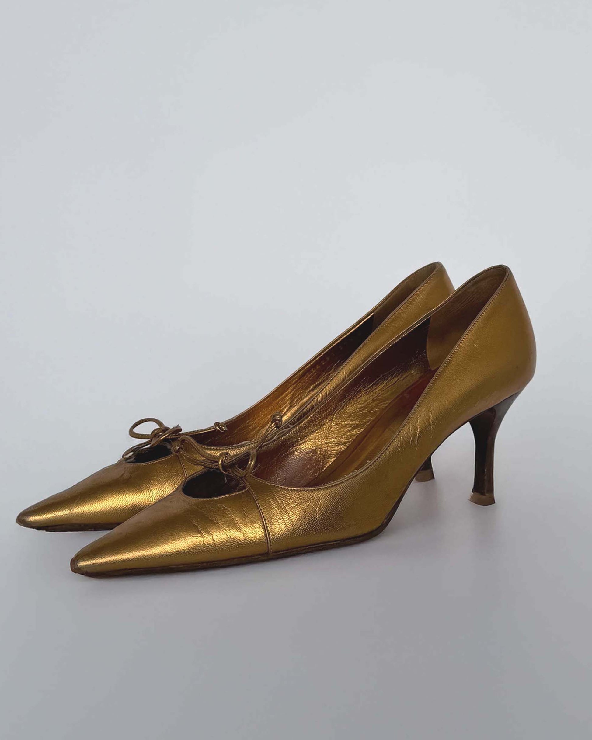 Side view of Gucci Gold Leather Heels