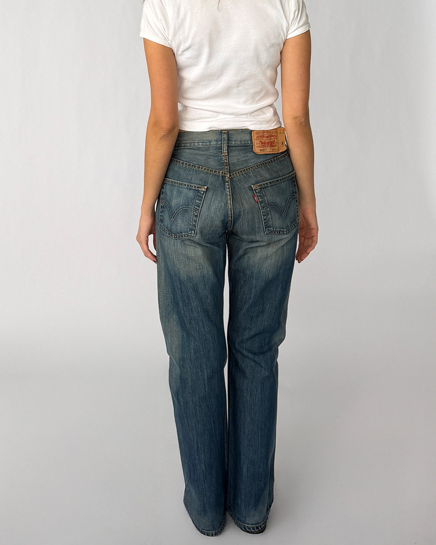Back view of vintage Levi's 501 jeans in medium wash 