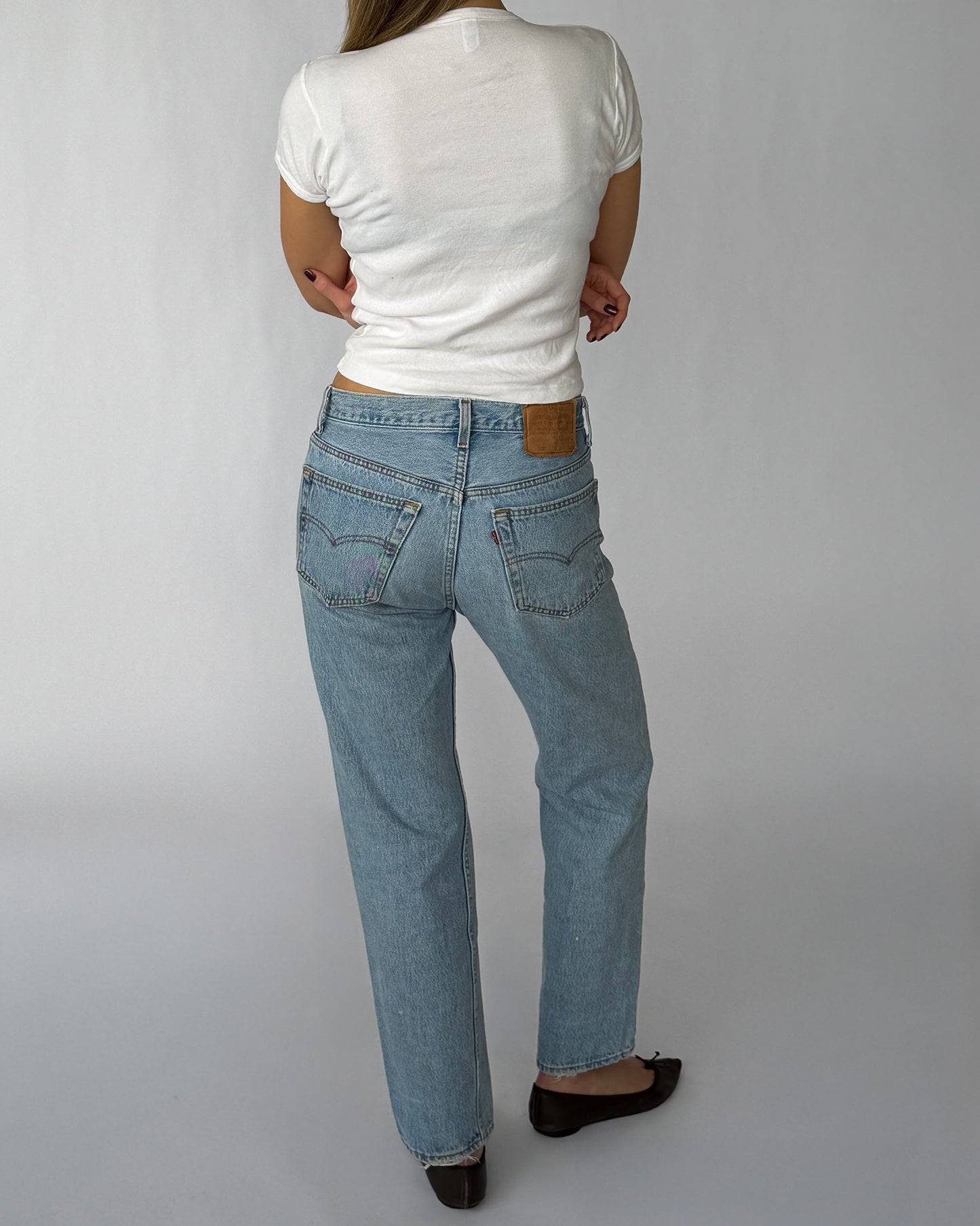 Back view of vintage Levi's 501s in a light wash
