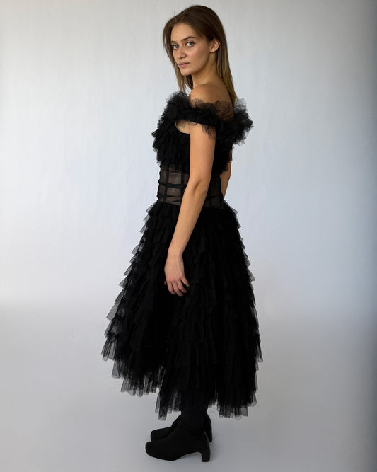 Side view of vintage tulle black dress with layered ruffles