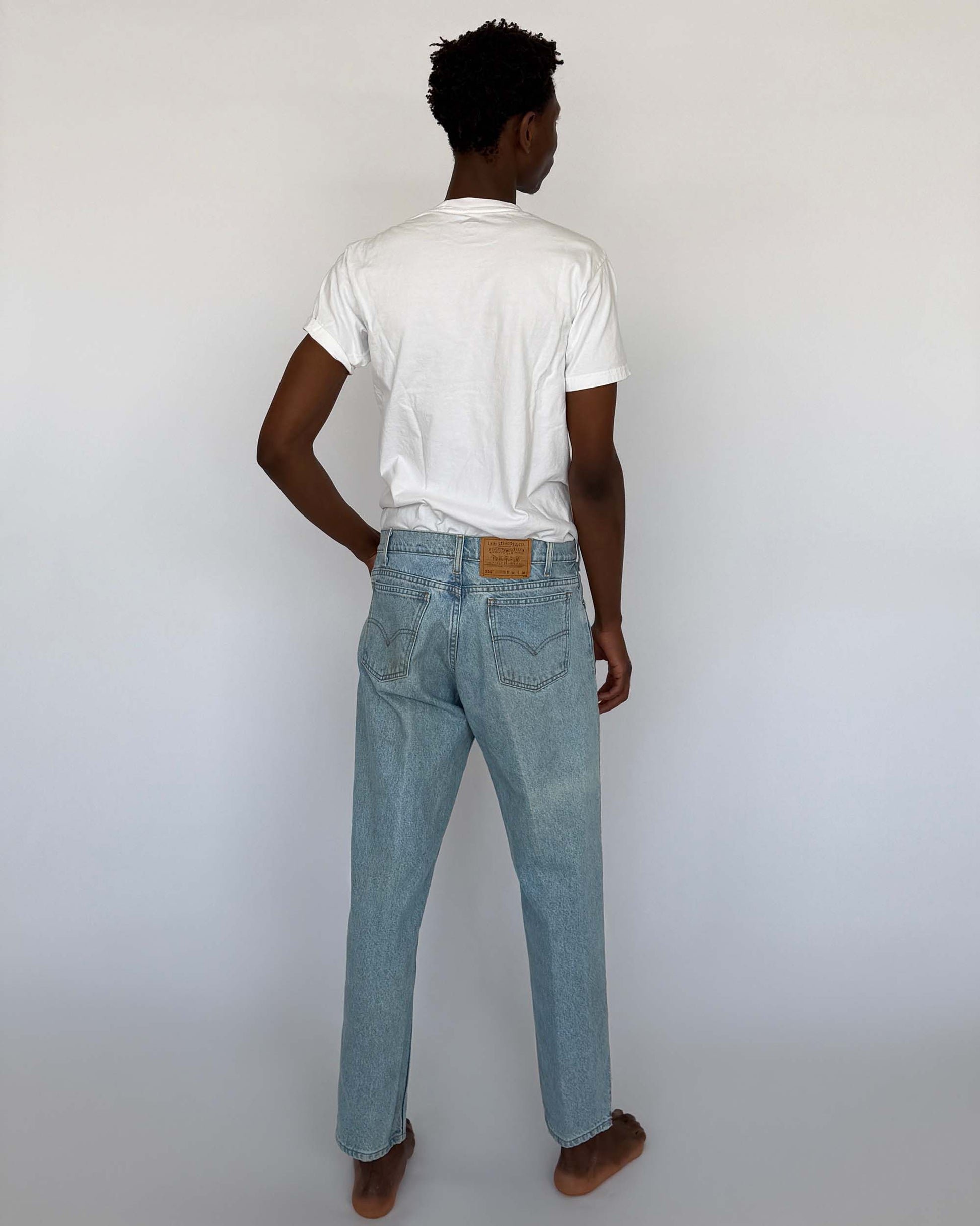 Back view of light wash vintage Levi's 550