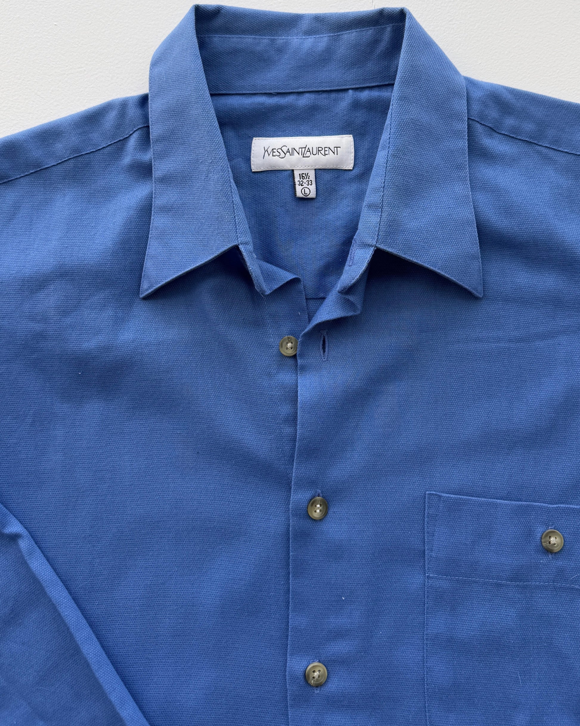Yves Saint Laurent label on vintage blue button down 